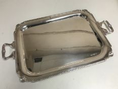 A large silver twin handled tray, Sheffield 1976, width 71 cm, 2861g.