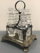 A nineteenth century silver four bottle cruet stand,