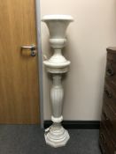 A white marble plant pedestal, with urn shaped table lamp, height 127 cm.