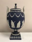 A Wedgwood Jasper Ware twin handled urn with cover, height 31 cm.
