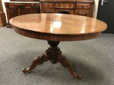 A Victorian mahogany oval breakfast table on tripod base, width 138 cm.