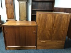 A mid 20th century teak sliding door cupboard, width 80 cm,