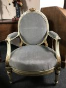 A 19th century continental painted and gilded open armchair, upholstered in green fabric,