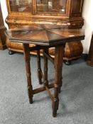 A 19th century specimen wood campaign table, on folding base, labelled Carolis & Sons, Columbo,