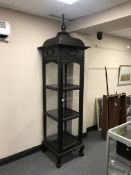 An Anglo Indian four sided display cabinet, with pagoda top, width 65 cm.