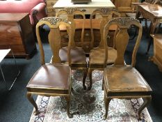 A set of four Queen Anne style oak dining chairs (4)