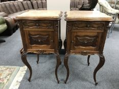 A pair of French walnut marble topped bedside stands, height 84 cm.