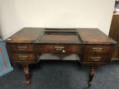 A 19th century mahogany desk fitted with five drawers on turned legs,