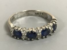 An 18ct white gold sapphire and diamond ring,