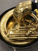 A brass sousaphone, cased. CONDITION REPORT: No apparent maker's name.