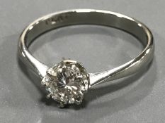 A platinum diamond solitaire ring CONDITION REPORT: Approximately 0.5 carat.