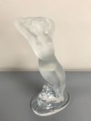 A Lalique crystal figurine modelled as a maiden standing by a rock, signed Lalique France,