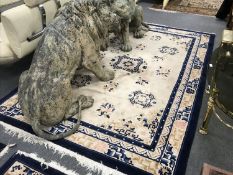 A fringed Chinese rug on cream ground, 275 cm x 184 cm.