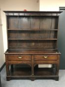 A George III oak country dresser,