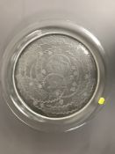 A Lalique crystal charger, decorated with a leaping ram, diameter 39 cm,