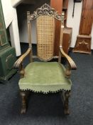 An 18th century style oak gentlemen's armchair with bergere back,