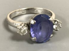 An 18ct white gold sapphire and diamond three-stone ring