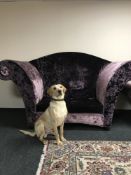 A contemporary over-sized armchair upholstered in purple fabric, height 135 cm.