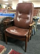 A mid twentieth century brown leather armchair, height 110 cm.