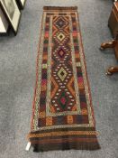 A Suzni Kilim carpet runner, 69 cm x 255 cm.
