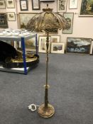A mid 20th century continental style brass adjustable floor lamp with shade,