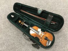 A child's violin and bow with carry case.