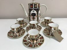 A set of six Royal Crown Derby coffee cans and saucers, and coffee pot, Imari pattern 1128.