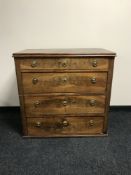 A 19th century mahogany four drawer chest, with circular brass handles,