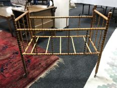 A mid twentieth century bamboo framed child's cot, length 94 cm.