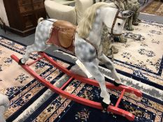A mid 20th century wooden painted rocking horse, by Honeycombe Horses, height 98 cm.