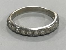 An 18ct white gold diamond half eternity ring, approximately 0.75ct.