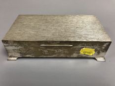 A silver cigar box with textured hinged lid, Harman Brothers, Birmingham 1976, 16.5 cm x 8.5 cm.