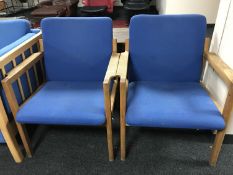 A pair of mid twentieth century oak framed armchairs upholstered in blue fabric, width 63 cm.