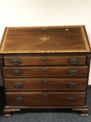 A George III inlaid mahogany bureau on bracket feet, width 97.5 cm.