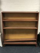A teak mid 20th century open bookcase,