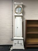 An antique painted continental long case drum head clock by Jens Mortenson,