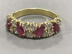 An 18ct gold ruby and diamond ring