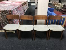 Four mid 20th century Danish teak dining room chairs