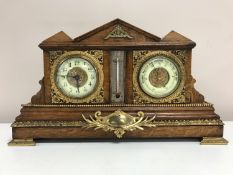 A late Victorian double clock barometer thermometer, oak framed and mounted in brass, width 46 cm.