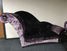 A contemporary over-sized chaise longue upholstered in purple fabric, height 155 cm.