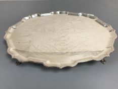 A silver tray with scalloped shaped edge, raised on short pad feet, 1233g, 40.5 cm x 31 cm, C. J.