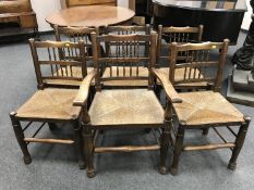 A set of six early twentieth century oak rush seated country chairs.