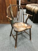 A 19th century elm wood Windsor armchair.