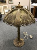 A mid 20th century continental style brass table lamp, the base decorated in foliage, height 70 cm.