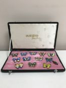 A set of twelve enamelled butterfly brooches on gilt metal,
