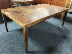 A mid 20th century Danish rosewood low table, on square tapered legs,