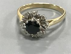 An 18ct gold diamond and sapphire cluster ring CONDITION REPORT: Size O.