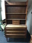 A mid 20th century teak multi section wall cabinet,