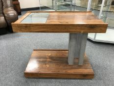 A mid 20th century rosewood and polished steel trolley on column support,