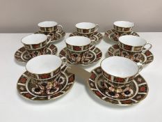 A set of eight Royal Crown Derby tea cups and matching saucers, Imari pattern 1128.